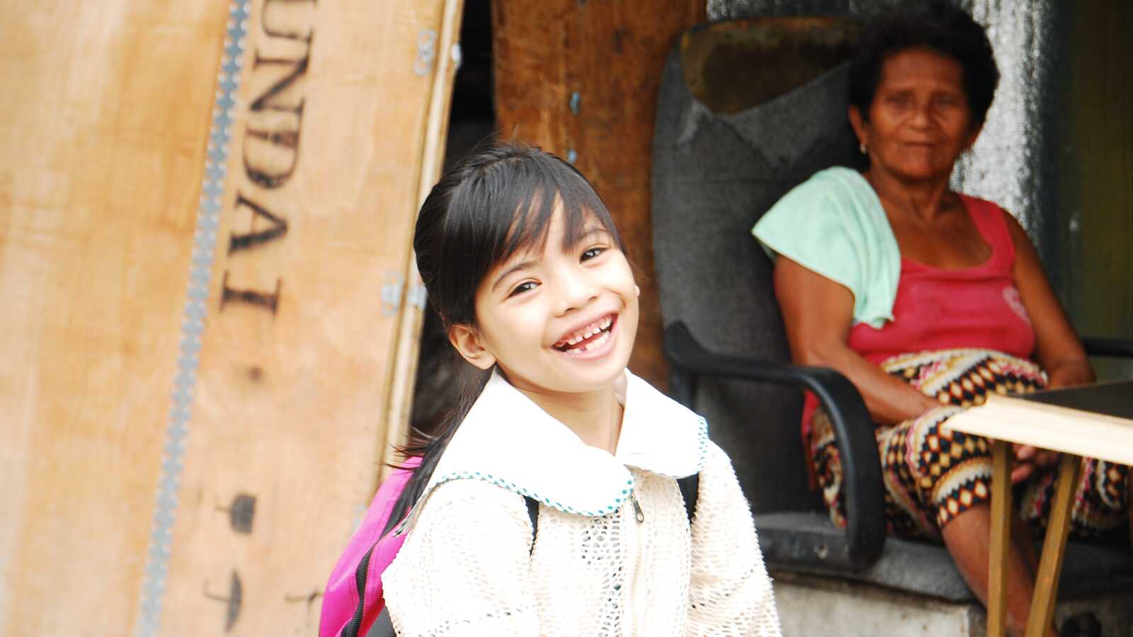 girl smiles for camera in the Philippines