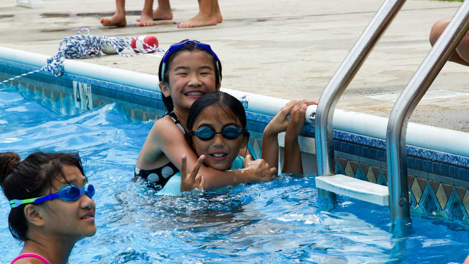 girls playing in pool