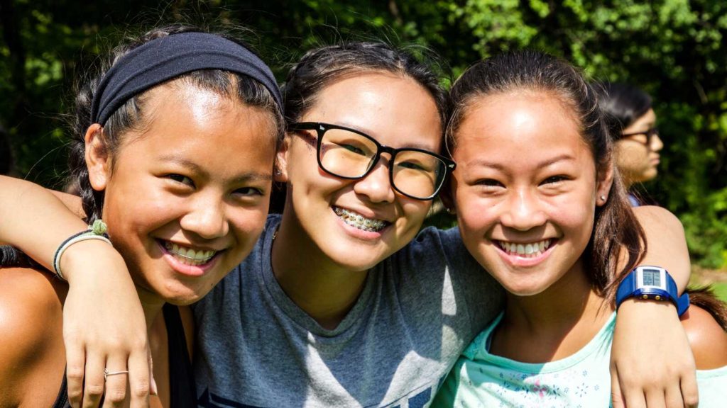 three girls smiling