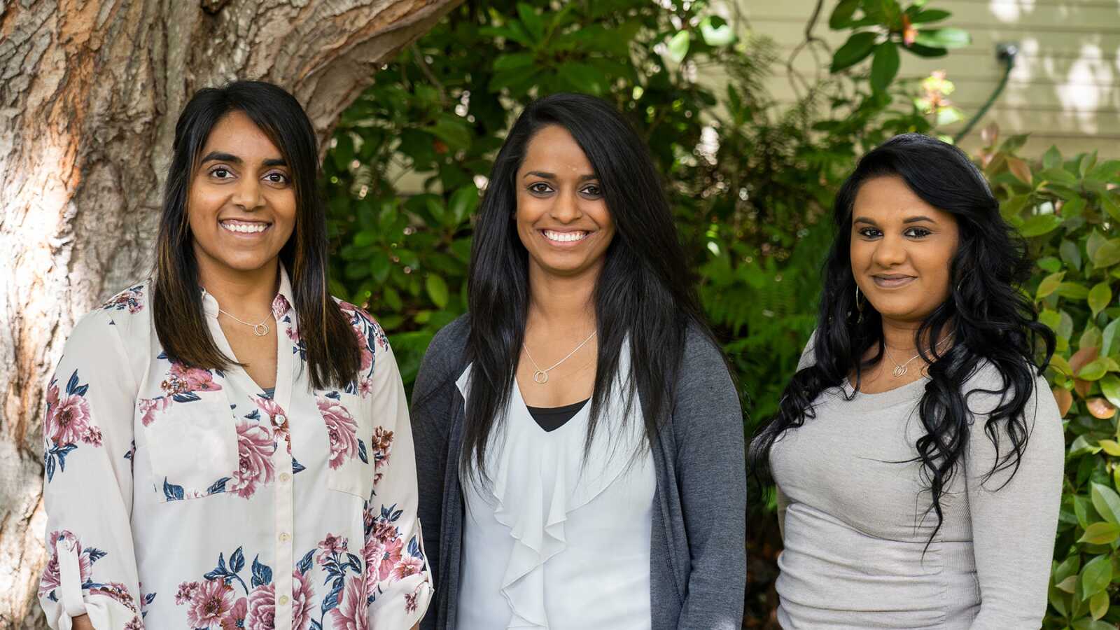 three girls smiling