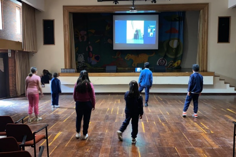 children dancing socially distanced