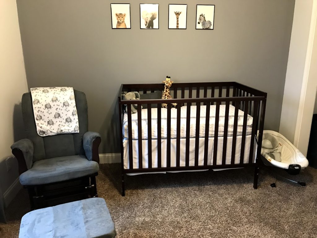 nursery room with crib and rocking chair
