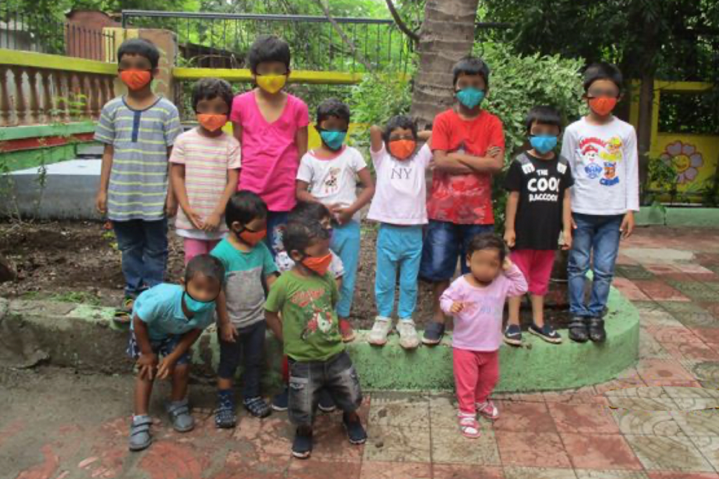 group of children wearing masks