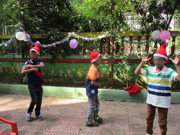 Children wearing Santa hats in India