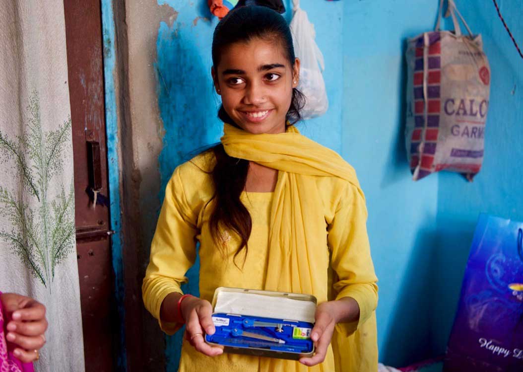 Girl smiling with books