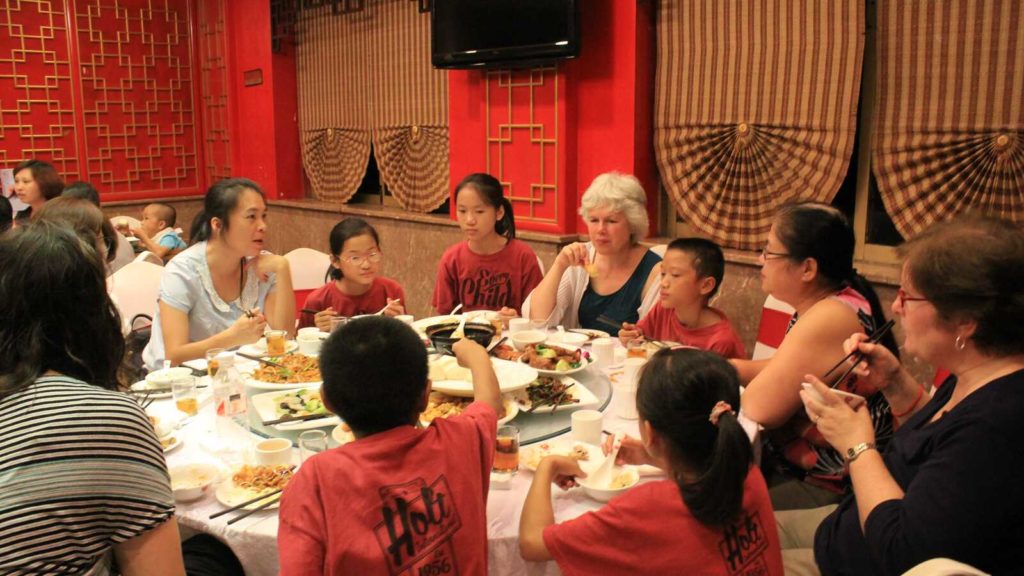 Group of people eating in Chinese restaurant