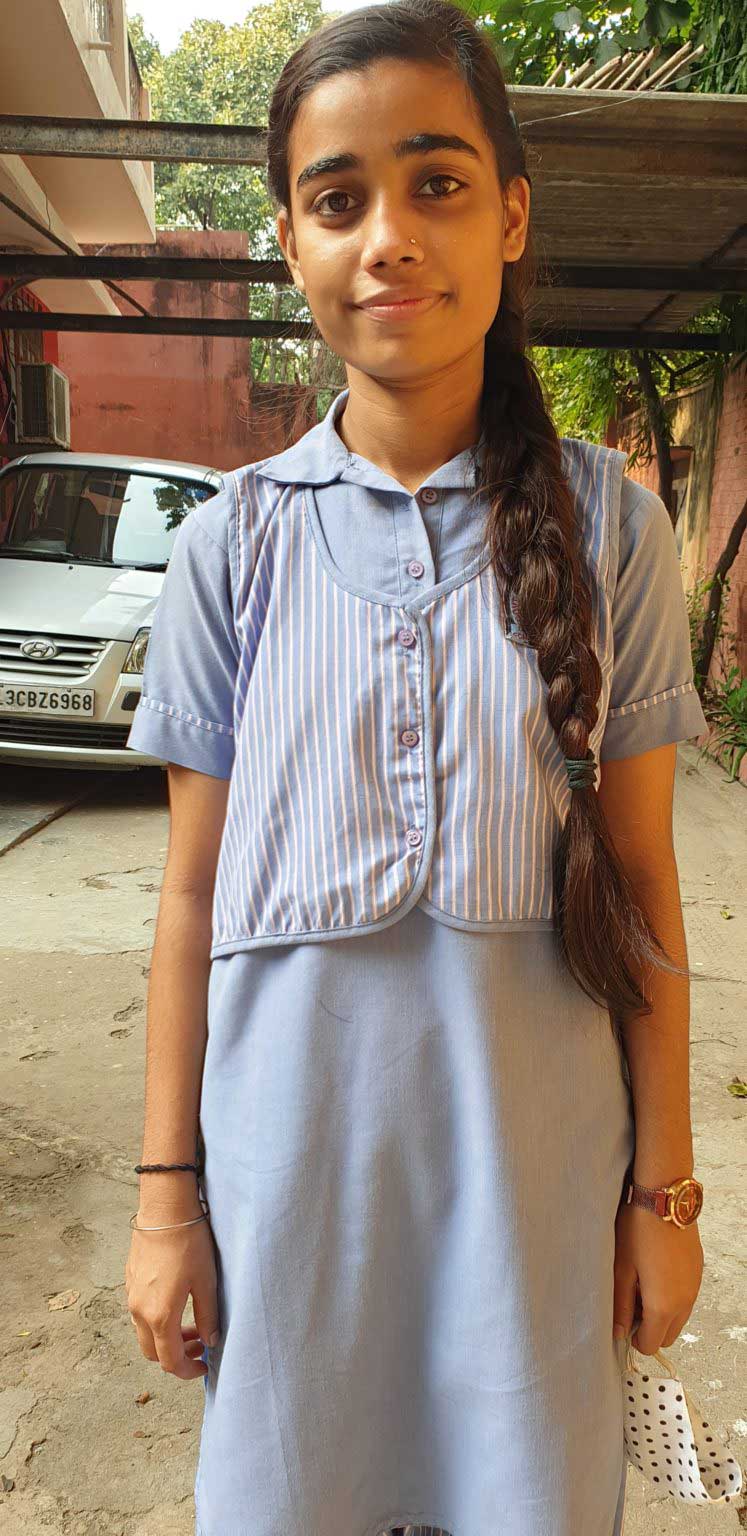 Girl smiling in blue dress