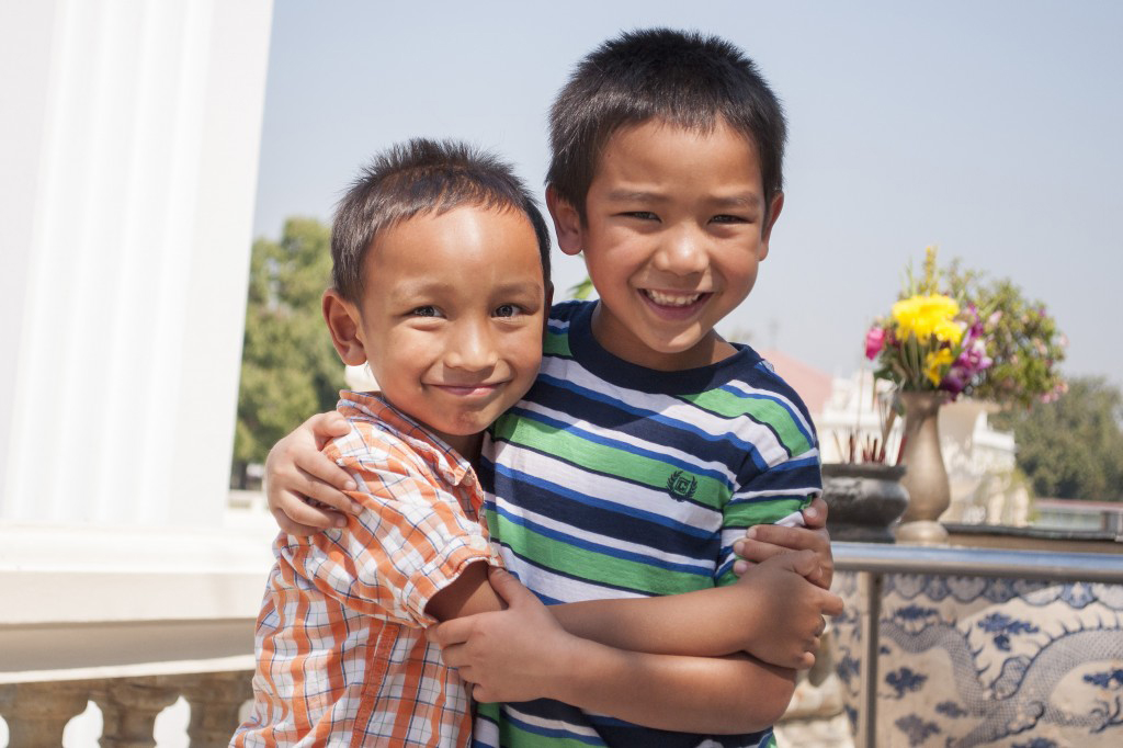 Two Thai adopted brothers hugging