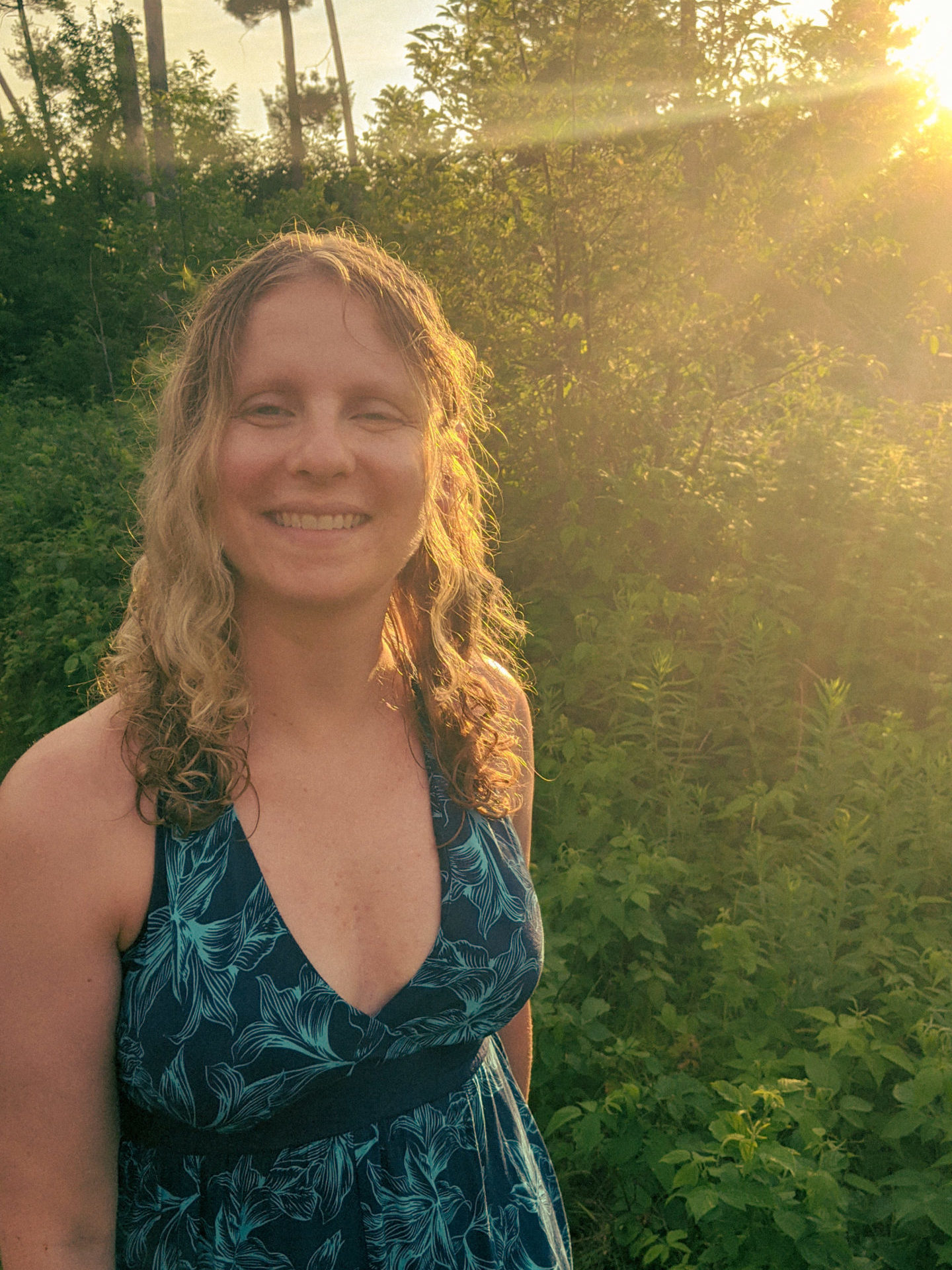 blonde woman smiling in the sunshine
