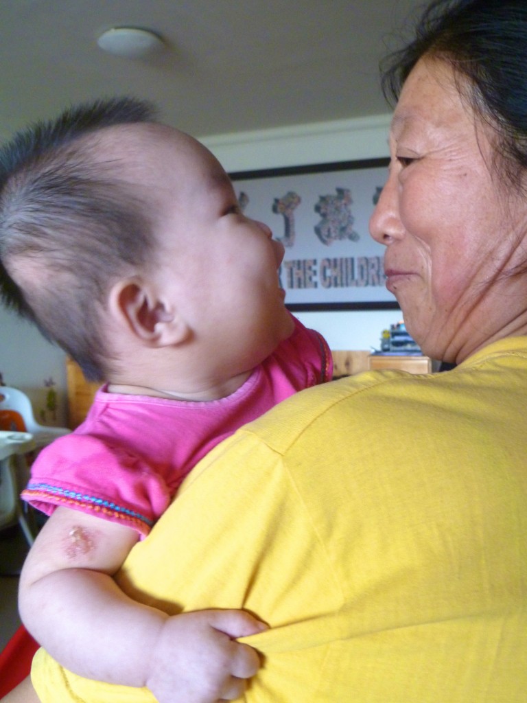 Caregiver and child at Peace House in China