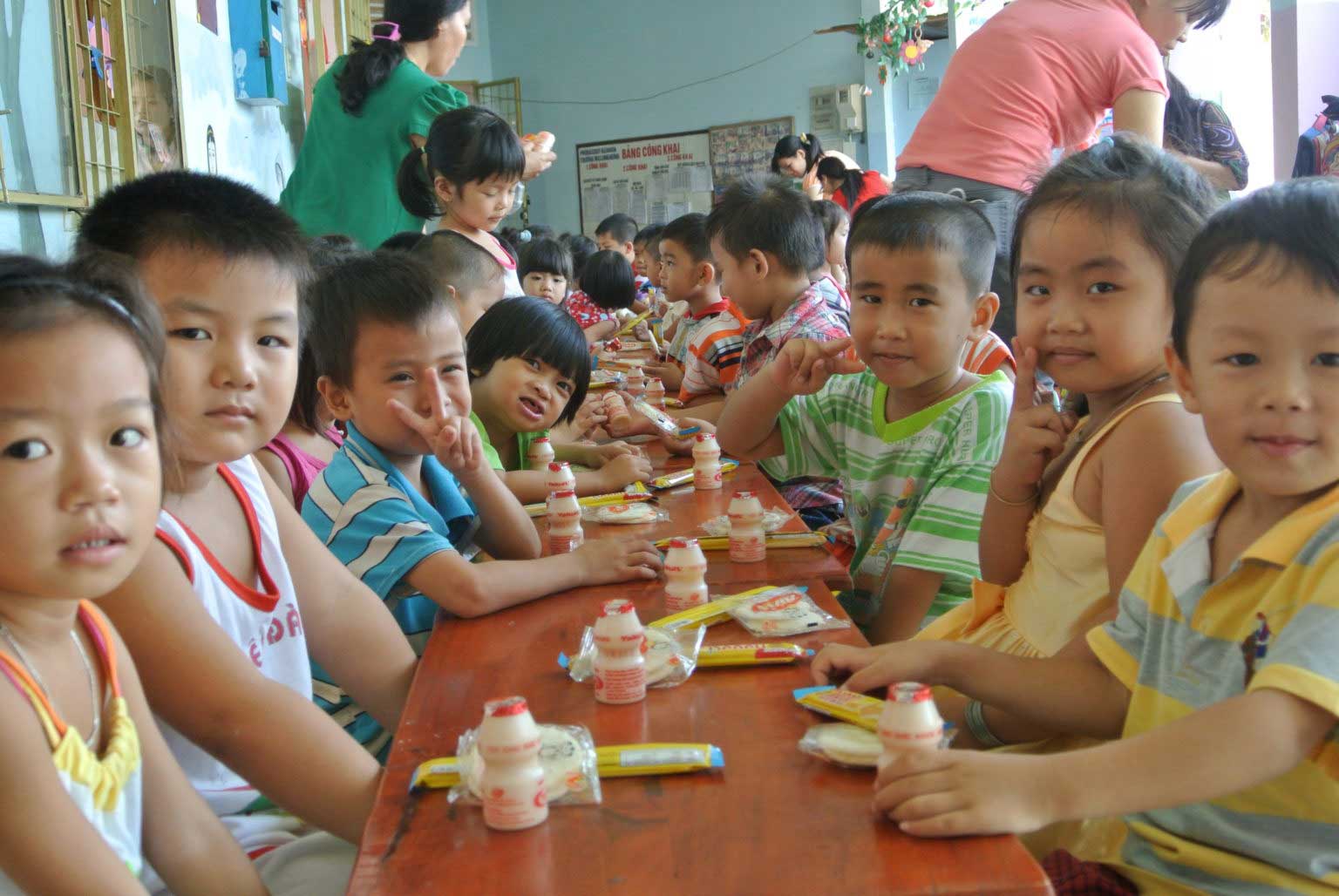 Children eating at Vietnam Daycare