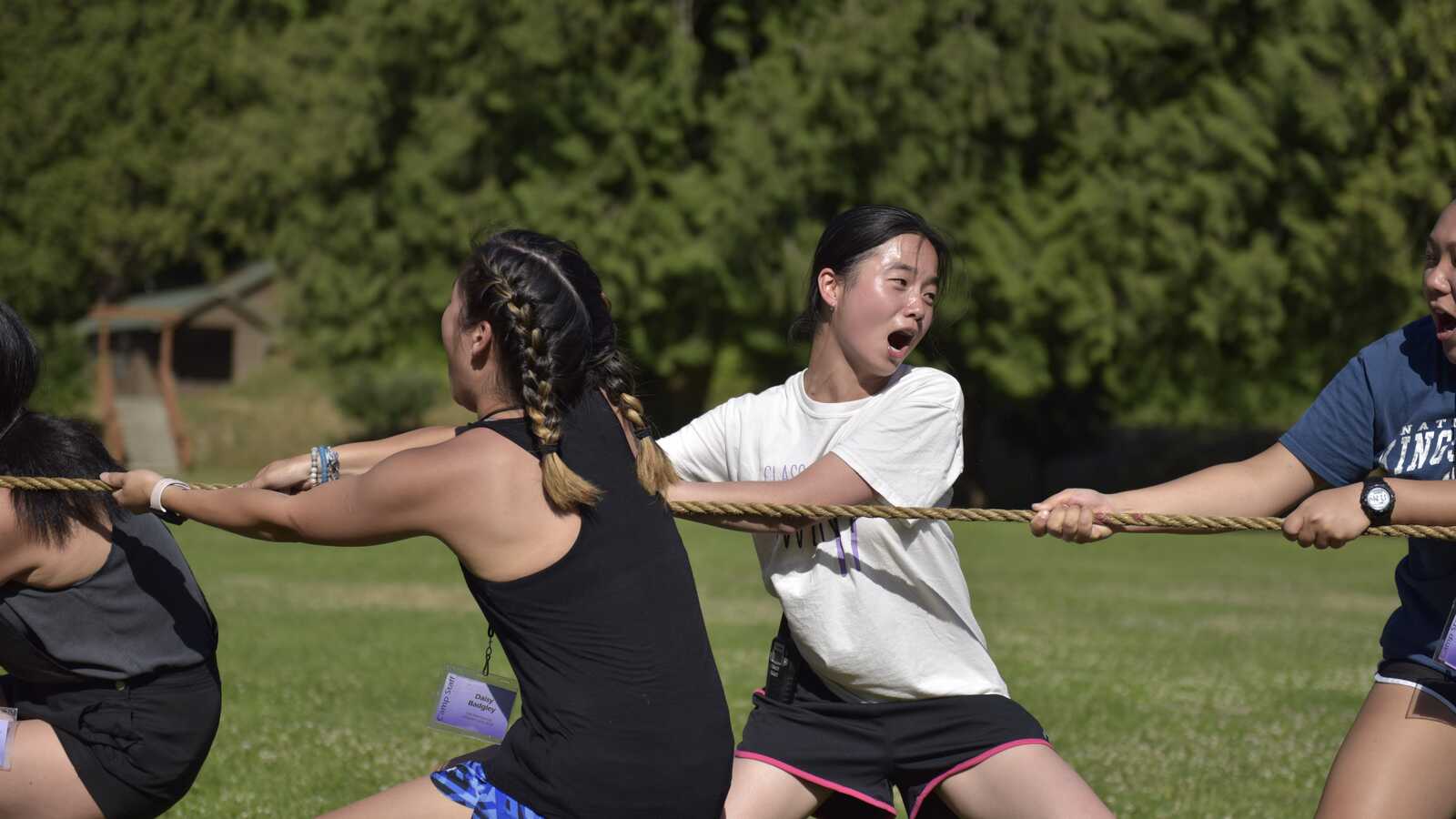 kids playing tug of war at adoptee summer camp