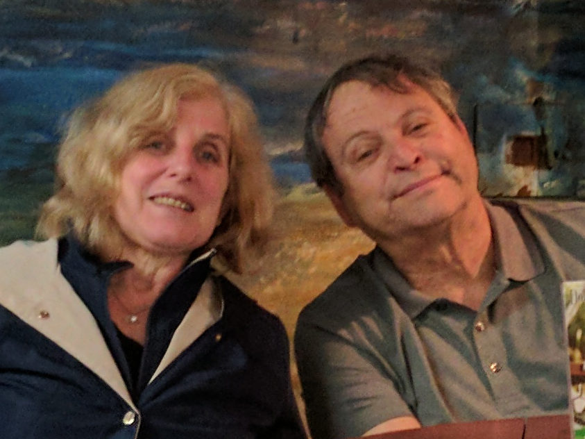 man and woman sitting at table