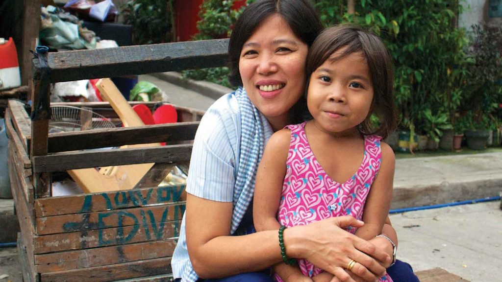 mom and daughter sitting outside