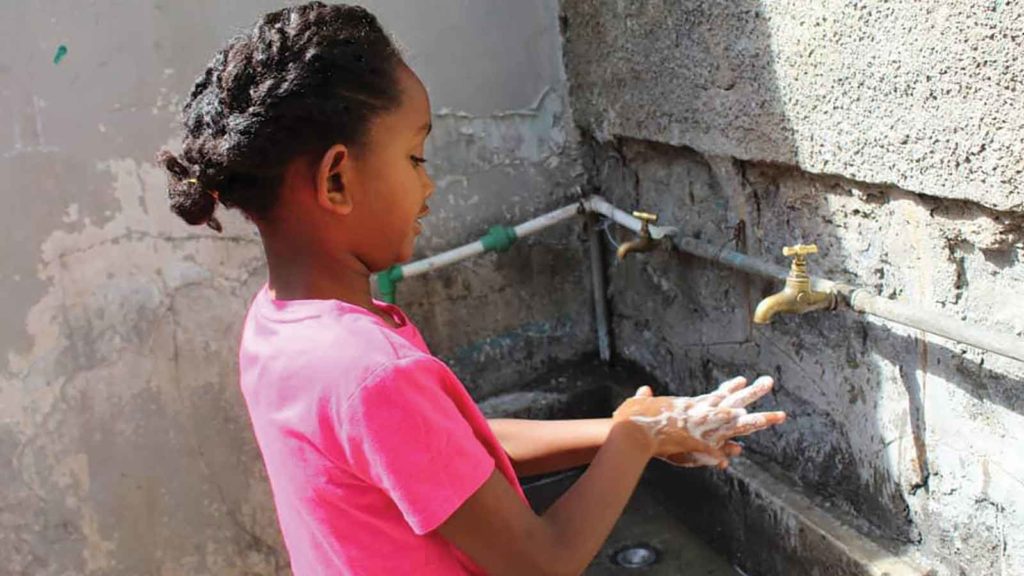 girl washing her hands