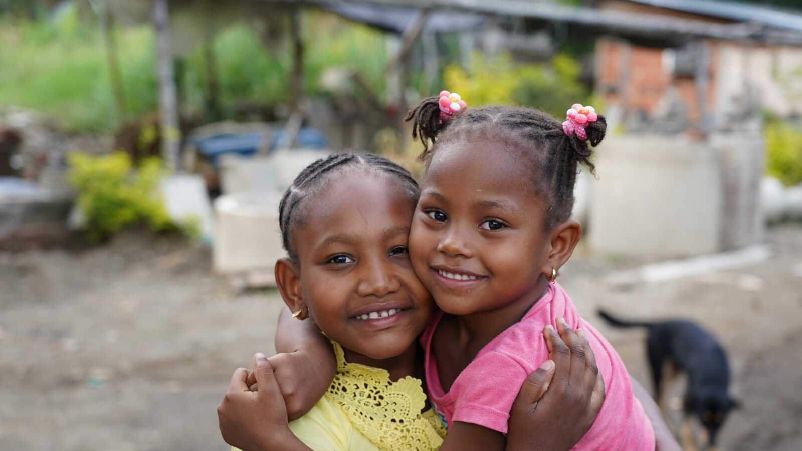 two girls hugging each other in Colombia