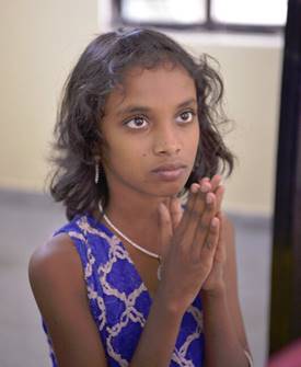 Girl praying in India