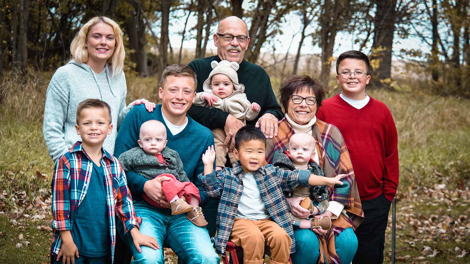adoptive family smiling for winter portrait
