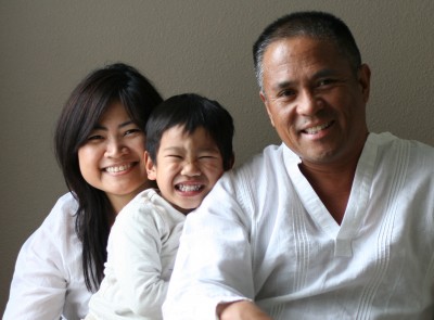 Adoptive family with Filipino son in white shirts