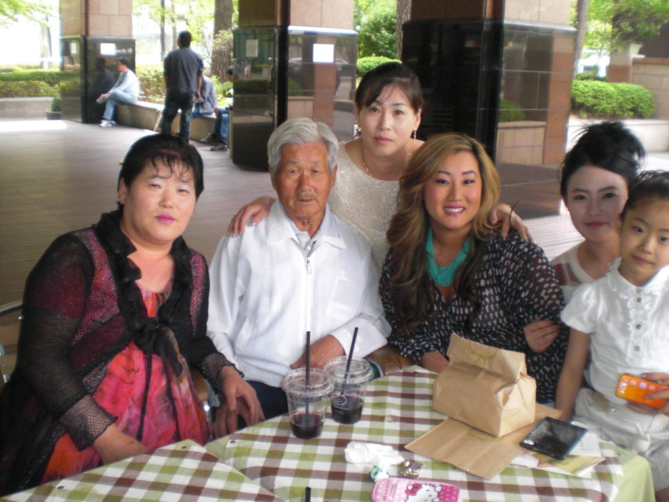 Courtney Young (center) with her biological aunt (far left), grandfather, mother and another aunt.