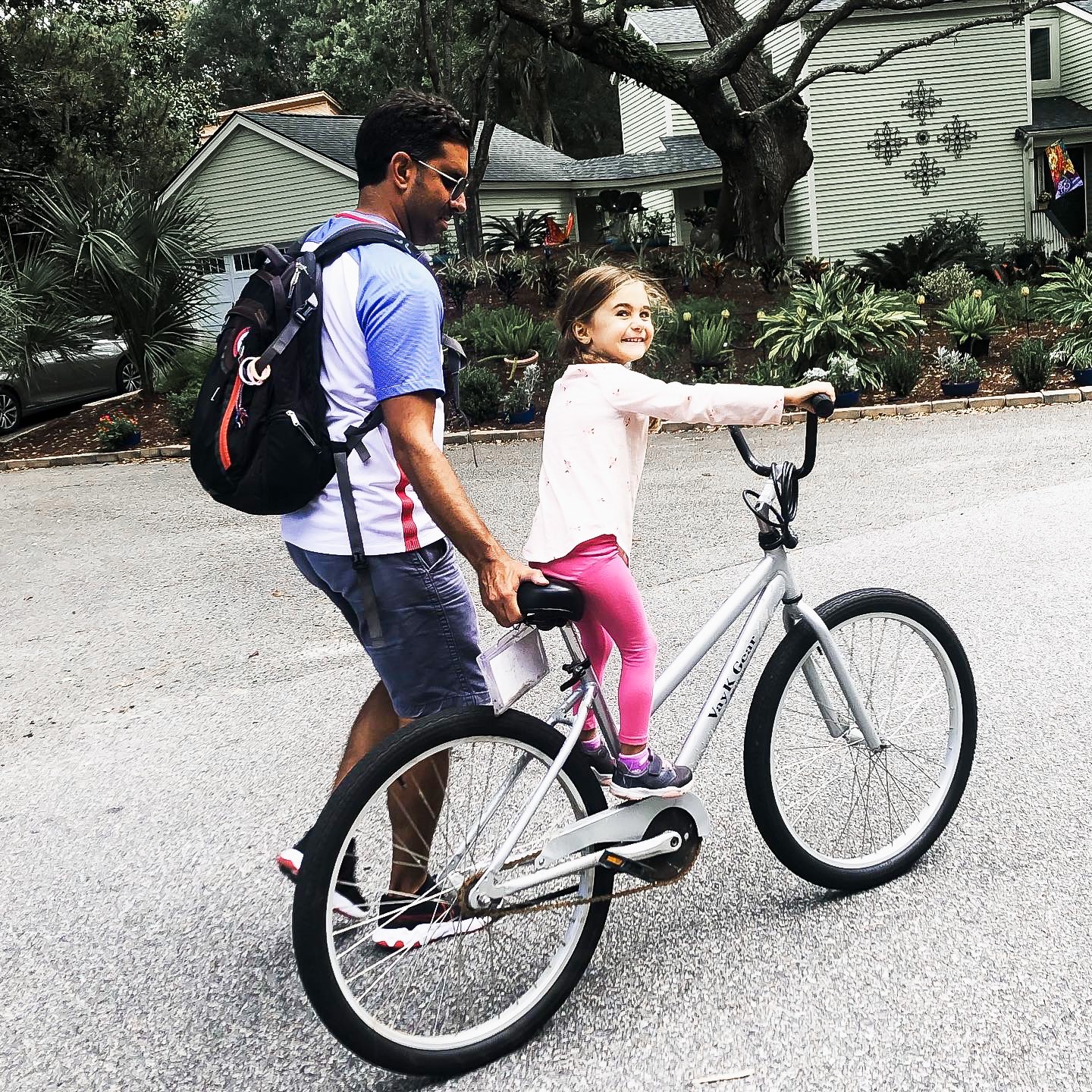 Father and daughter riding bike
