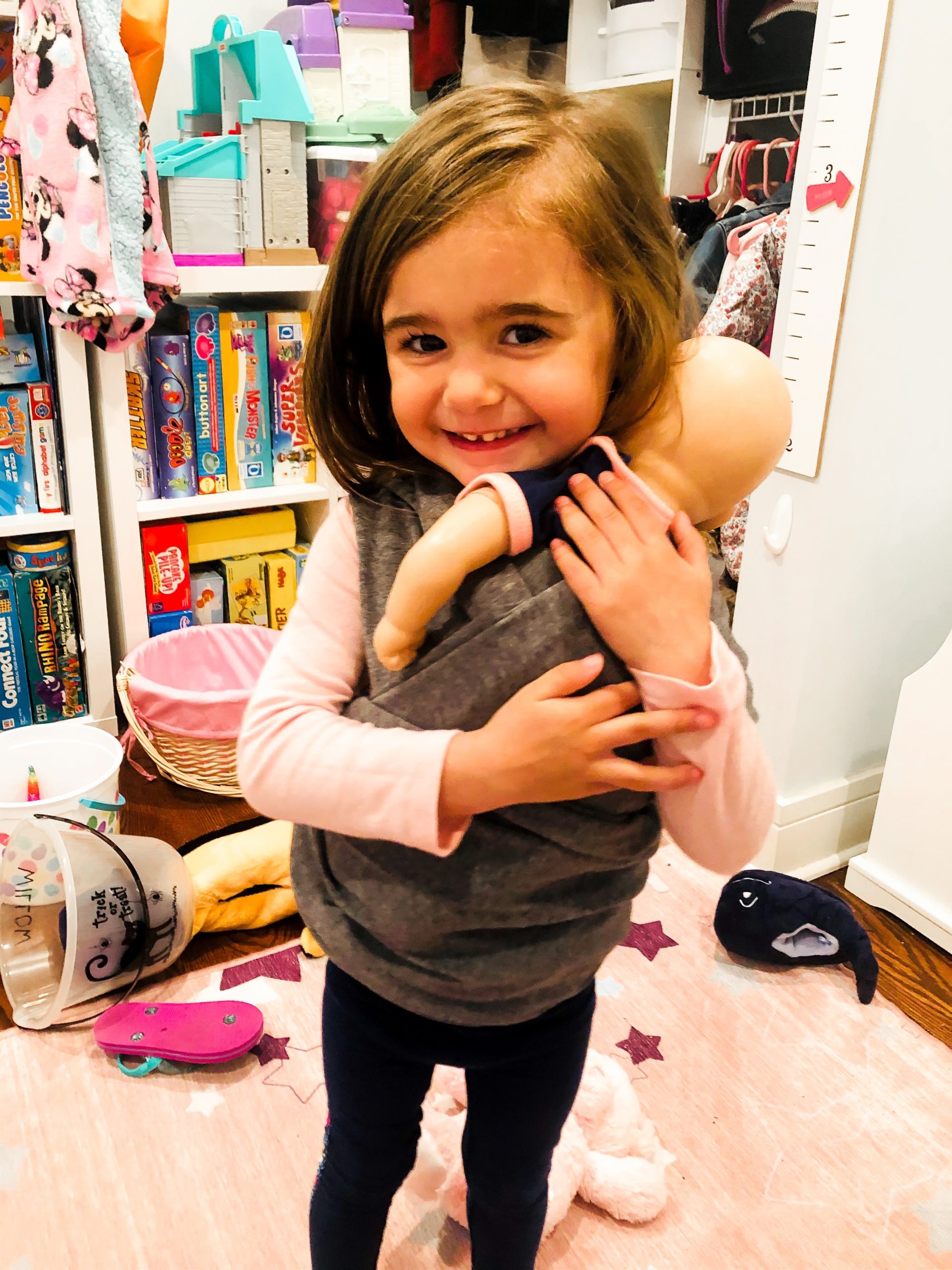 girl holding doll