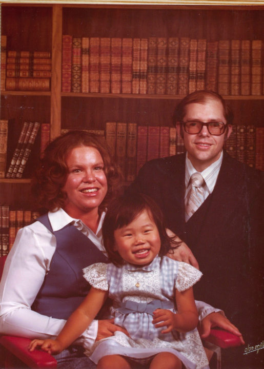Leh with her parents when she was little.