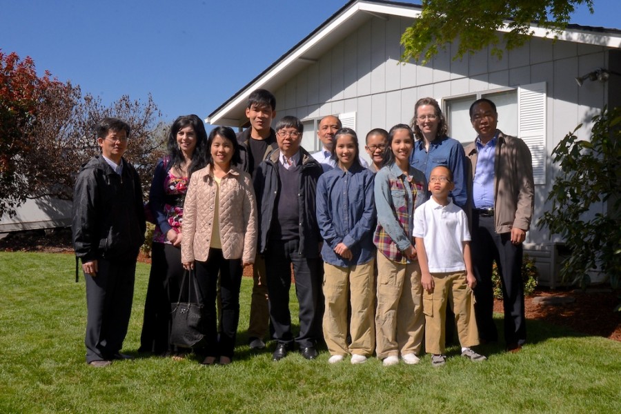 The Nguyen family pose for a picture with the delegates from Vietnam.