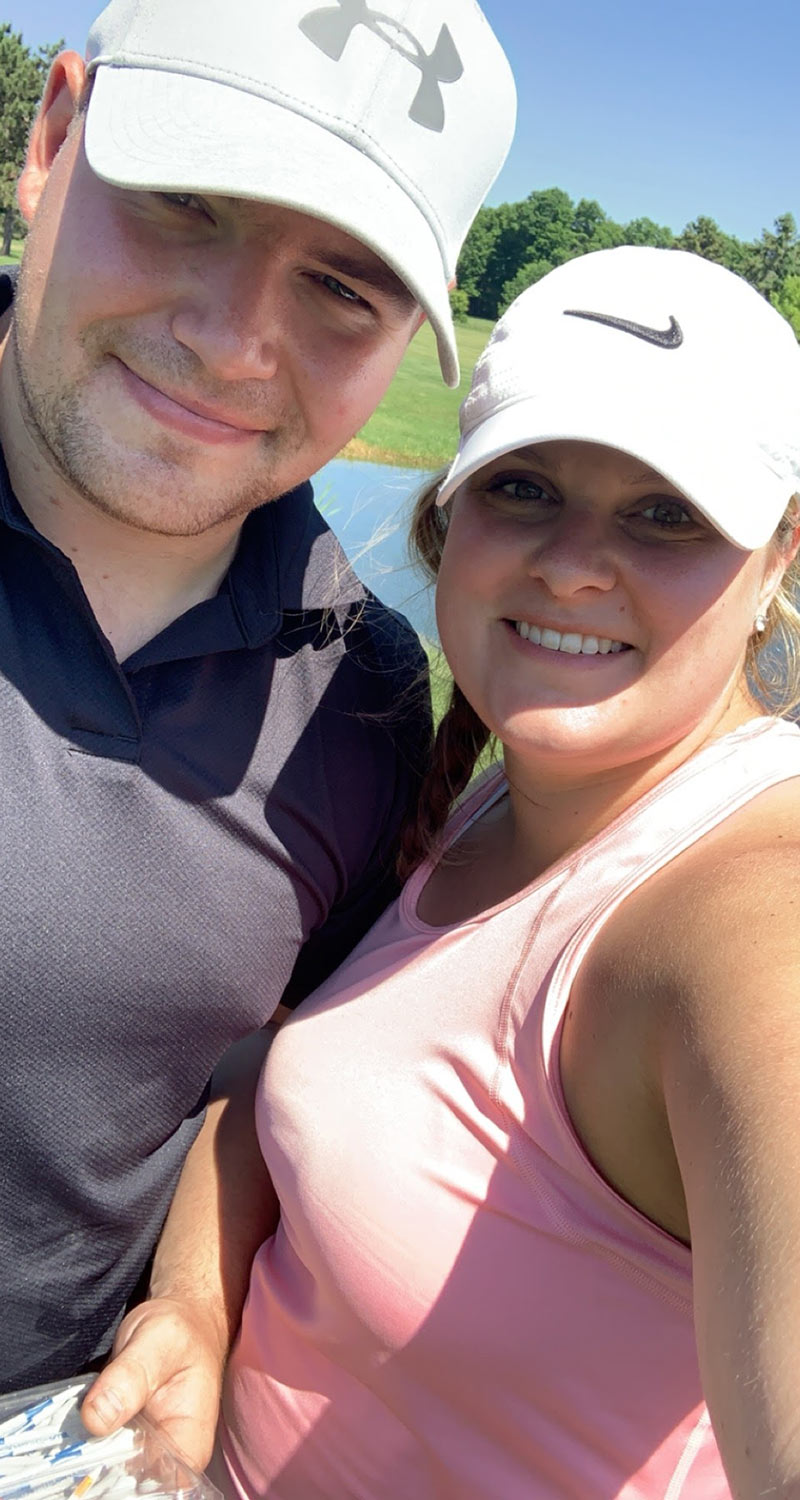 smiling man and woman in activewear