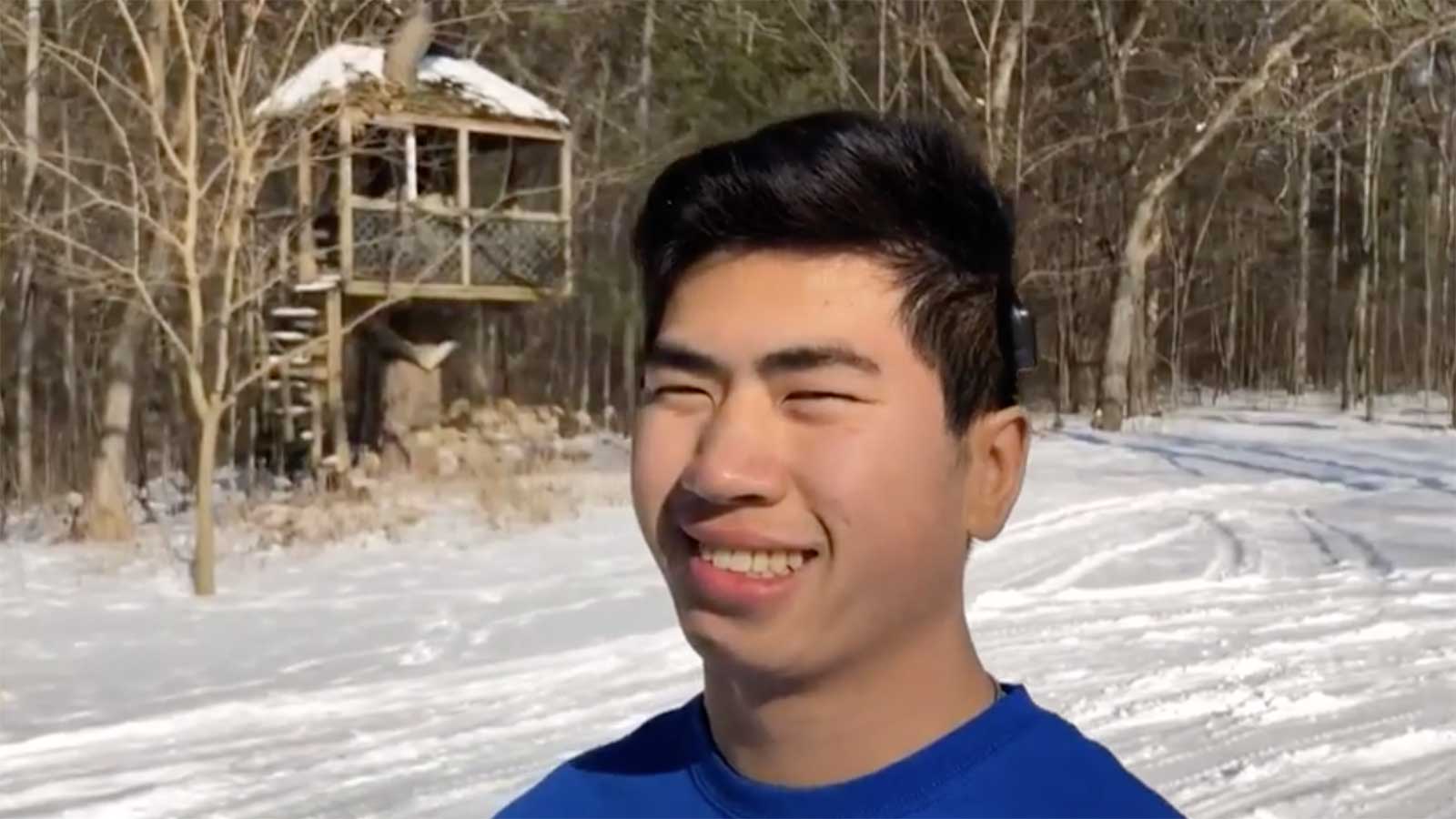 Chinese adoptee smiling in the snow