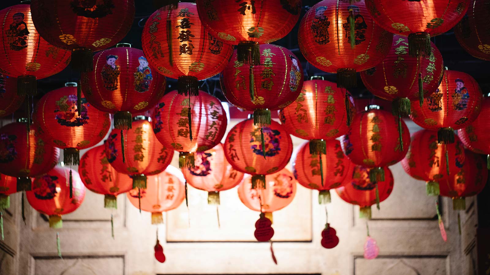 red chinese lanterns hanging from the ceiling