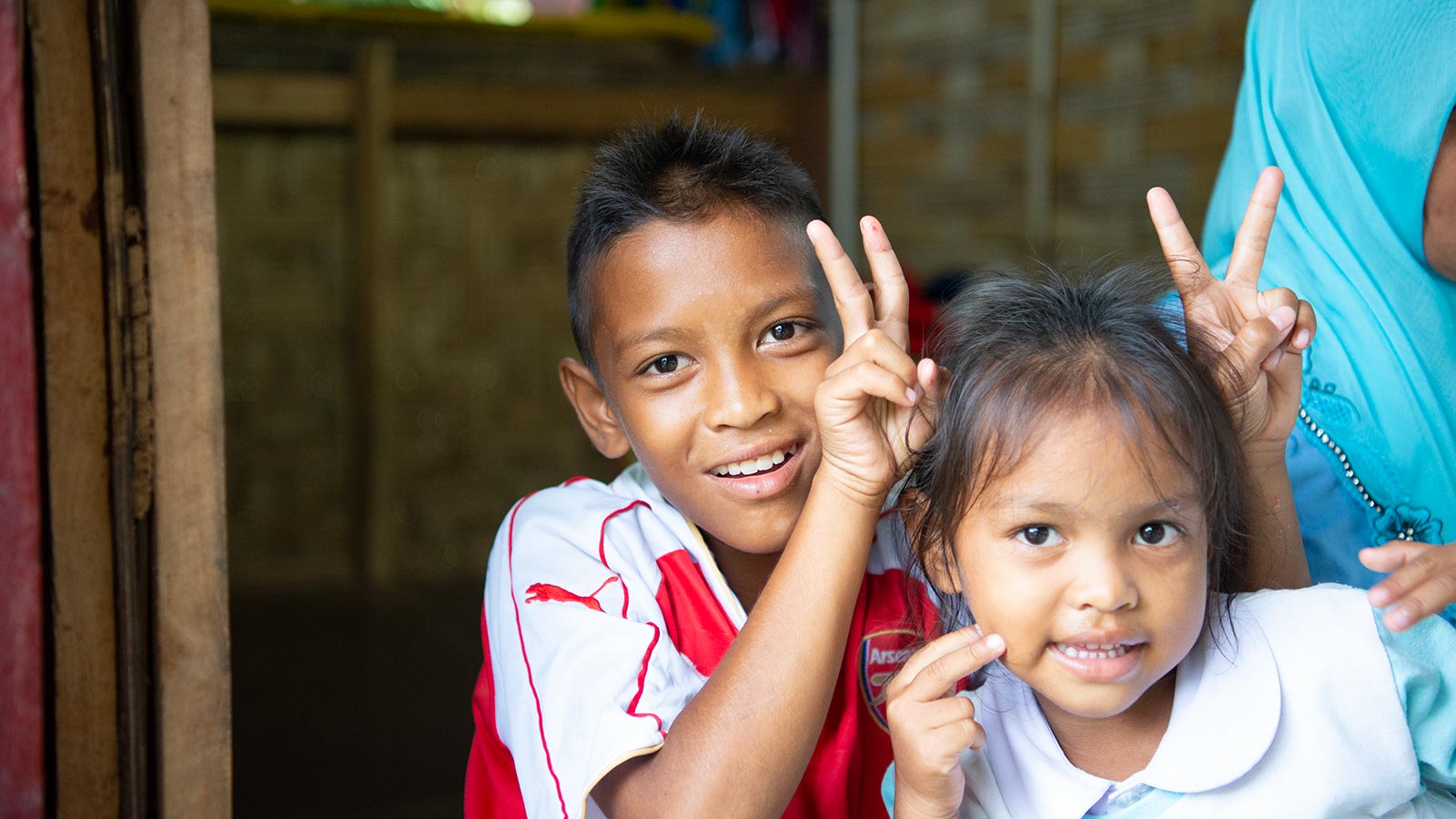 brother and sister in Thailand making silly faces