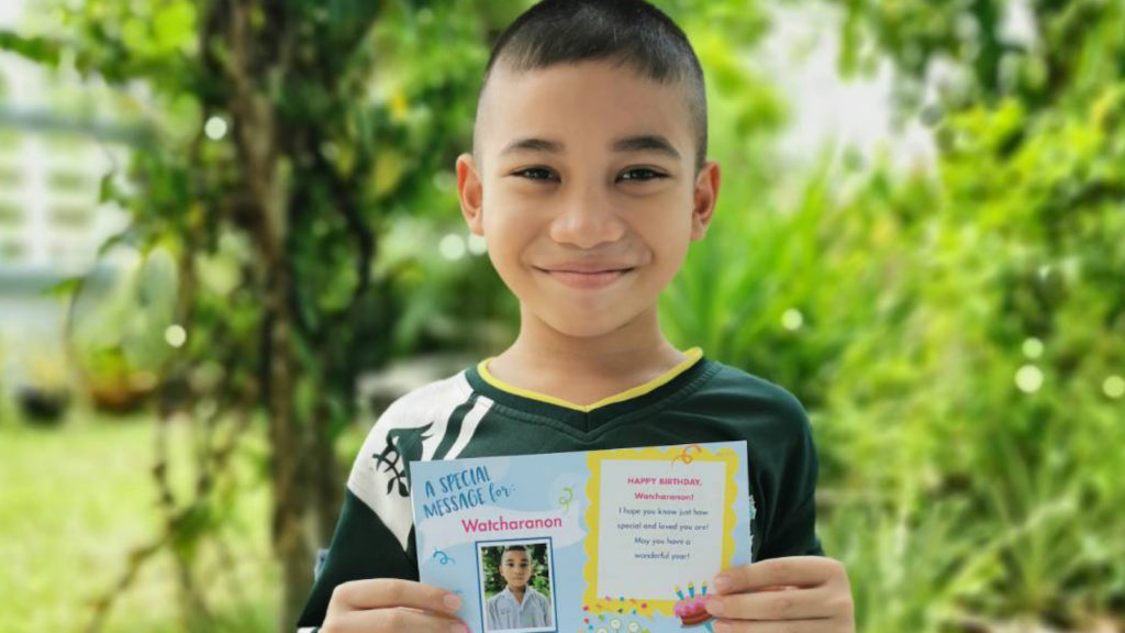 boy holding a birthday card