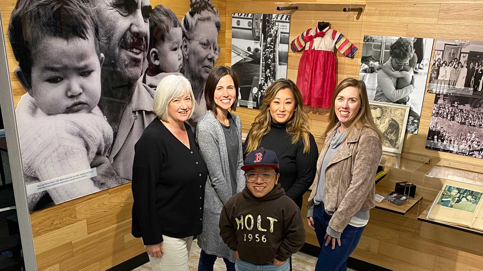 five people standing together and smiling at holt office