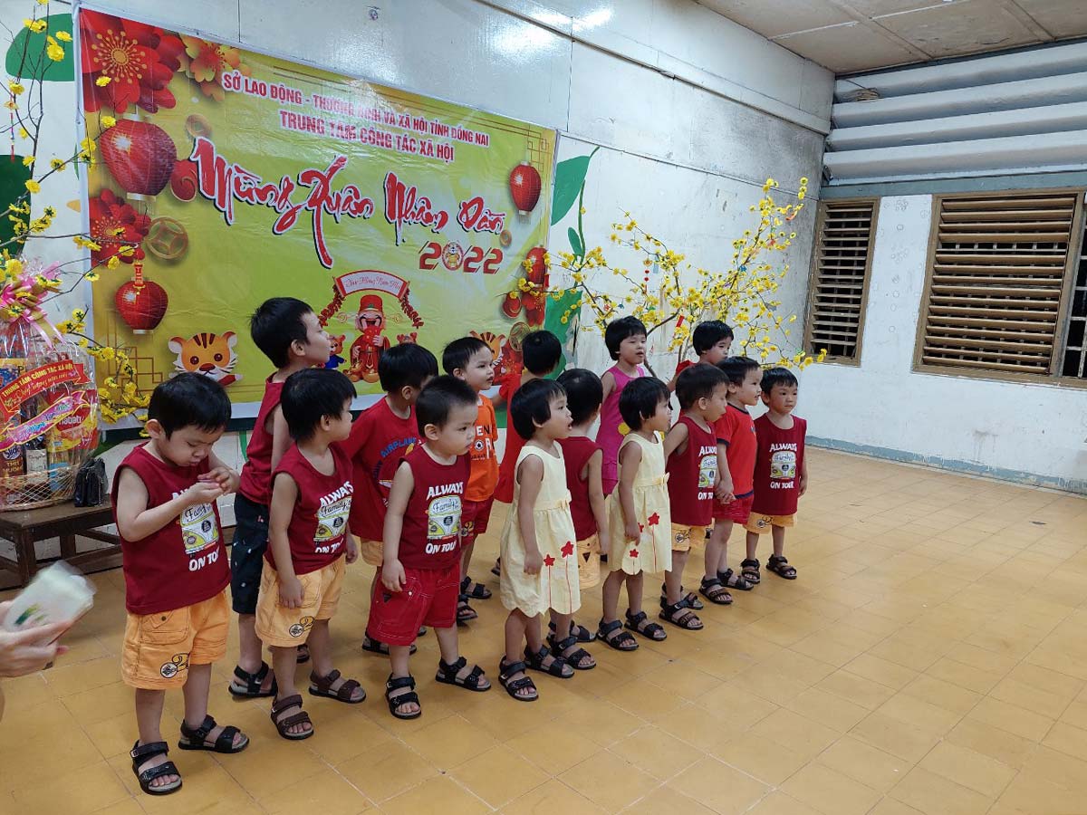 children wearing red celebrating tet in Vietnam