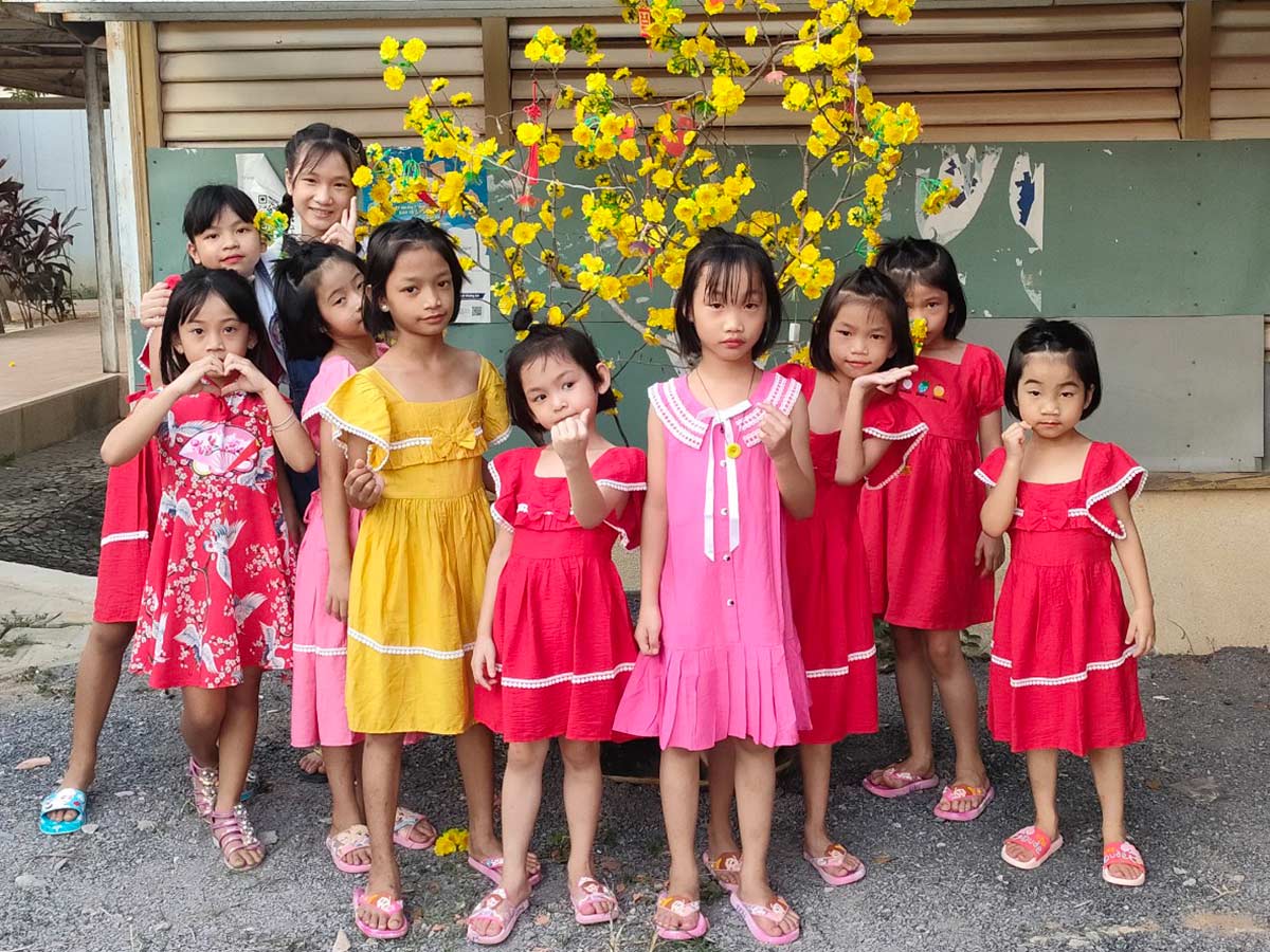 group of girls wearing special dresses celebrating tet in Vietnam