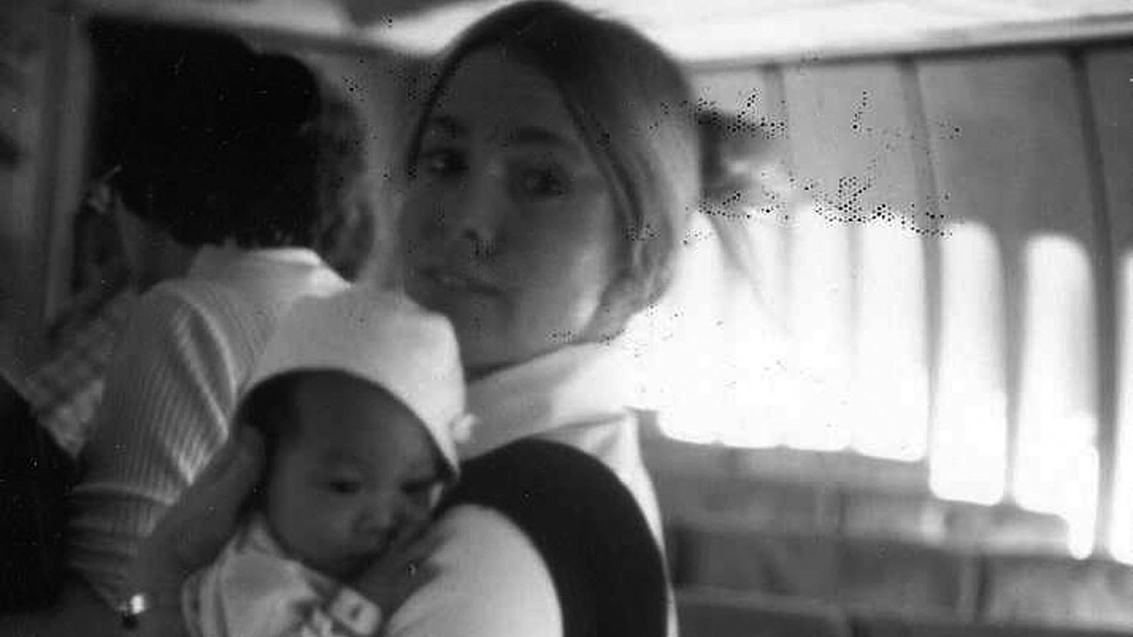 pan am flight attendant holding baby from Vietnam during Vietnam Babylift