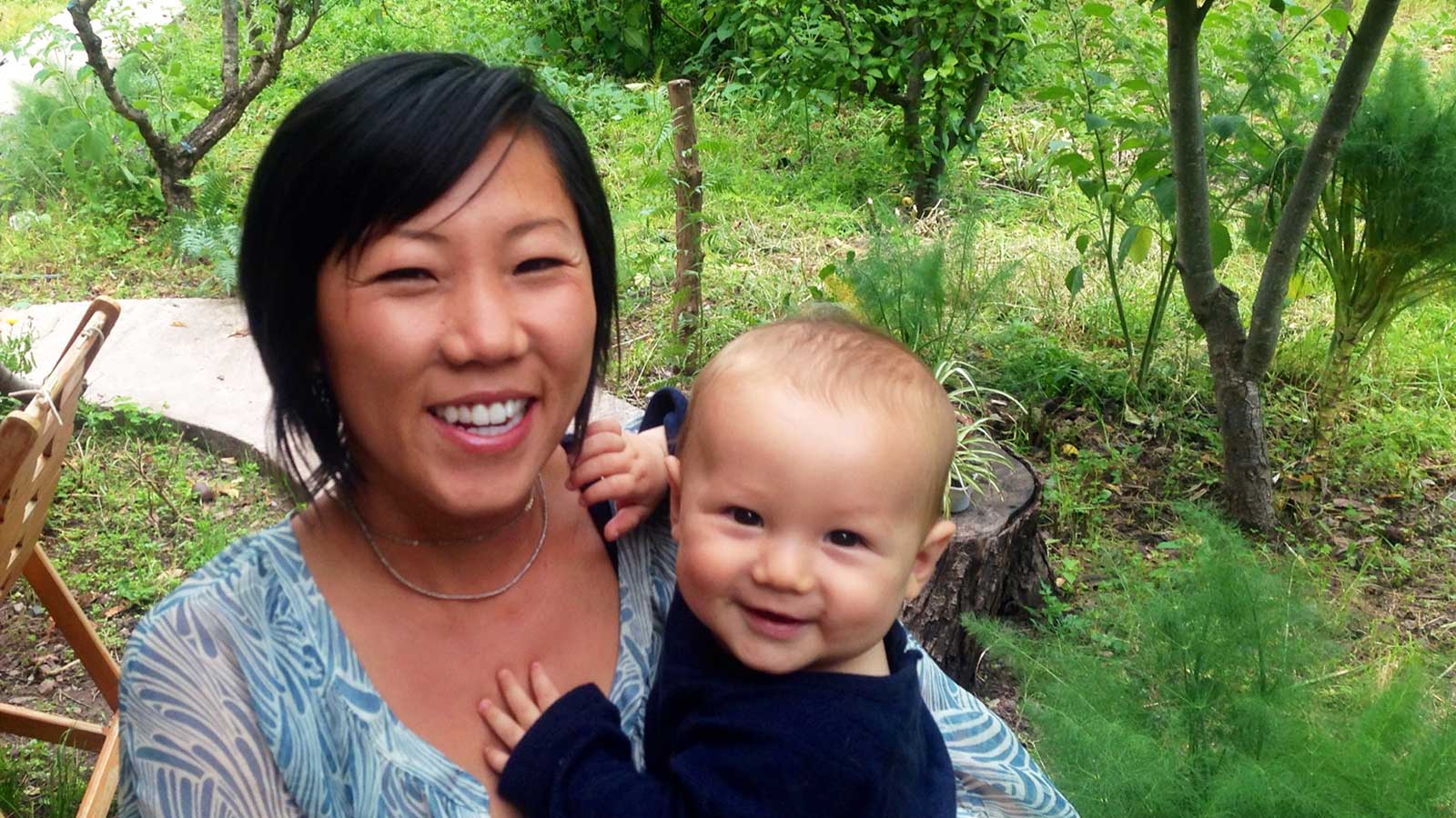 megan holds her baby shares adoptee's perspective on motherhood