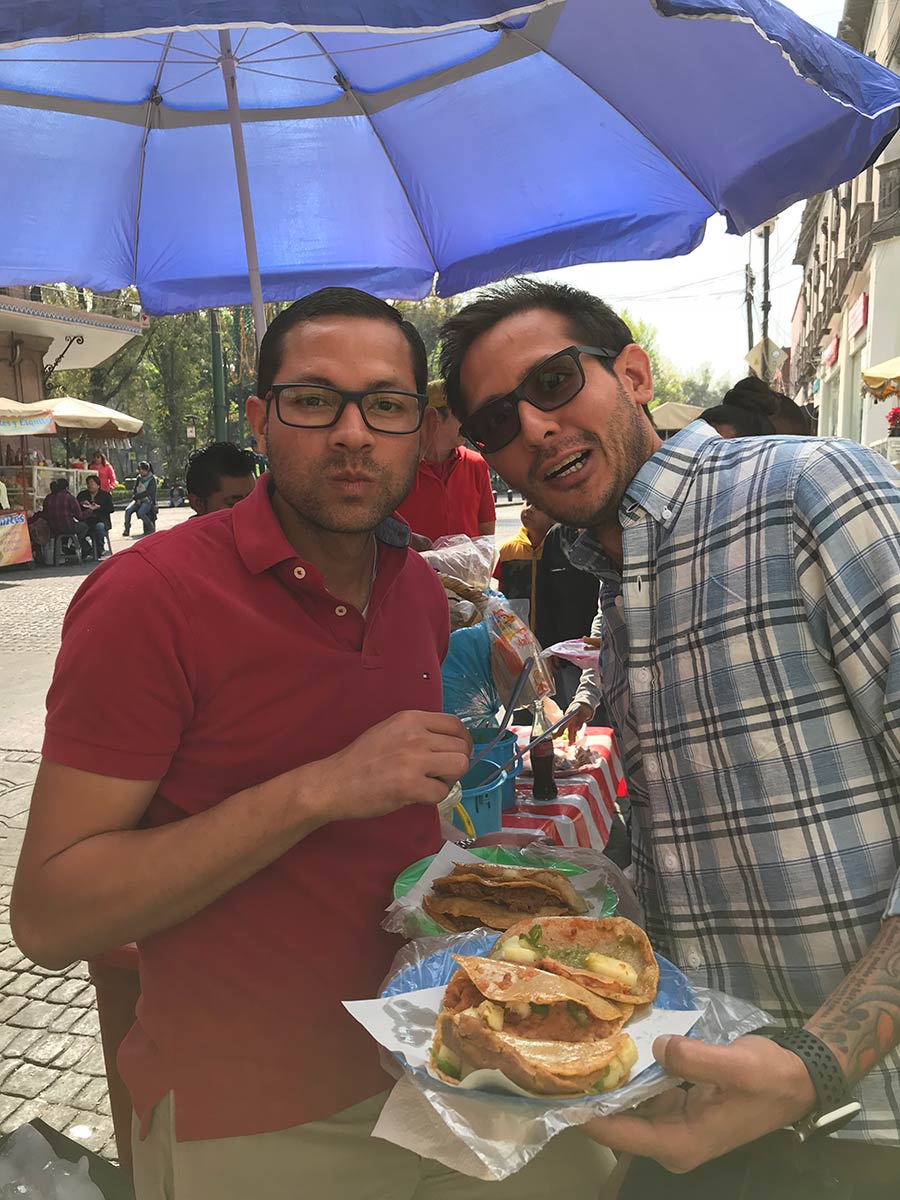 two smiling man at a restaurant