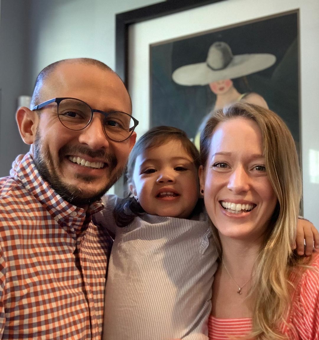 smiling parents and daughter