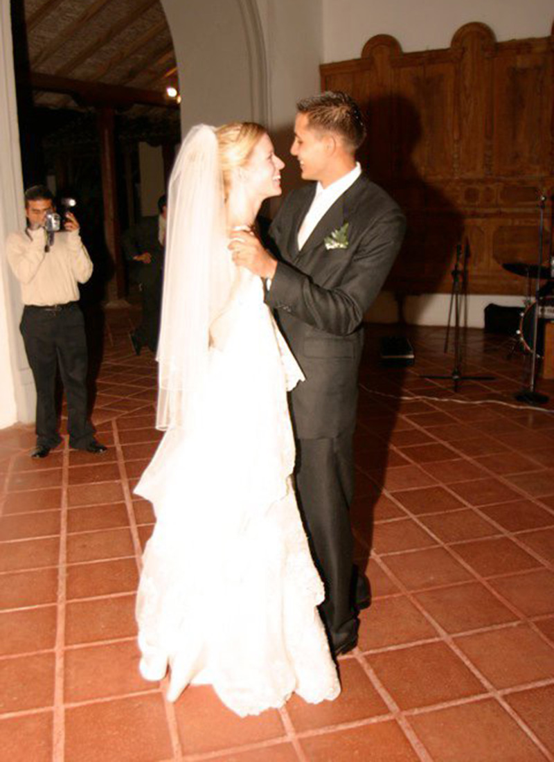 smiling bride and groom first dance at wedding
