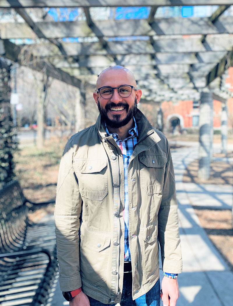 smiling man with beard and glasses