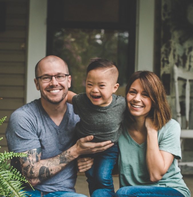 cropped photo - adopted family outside by lake