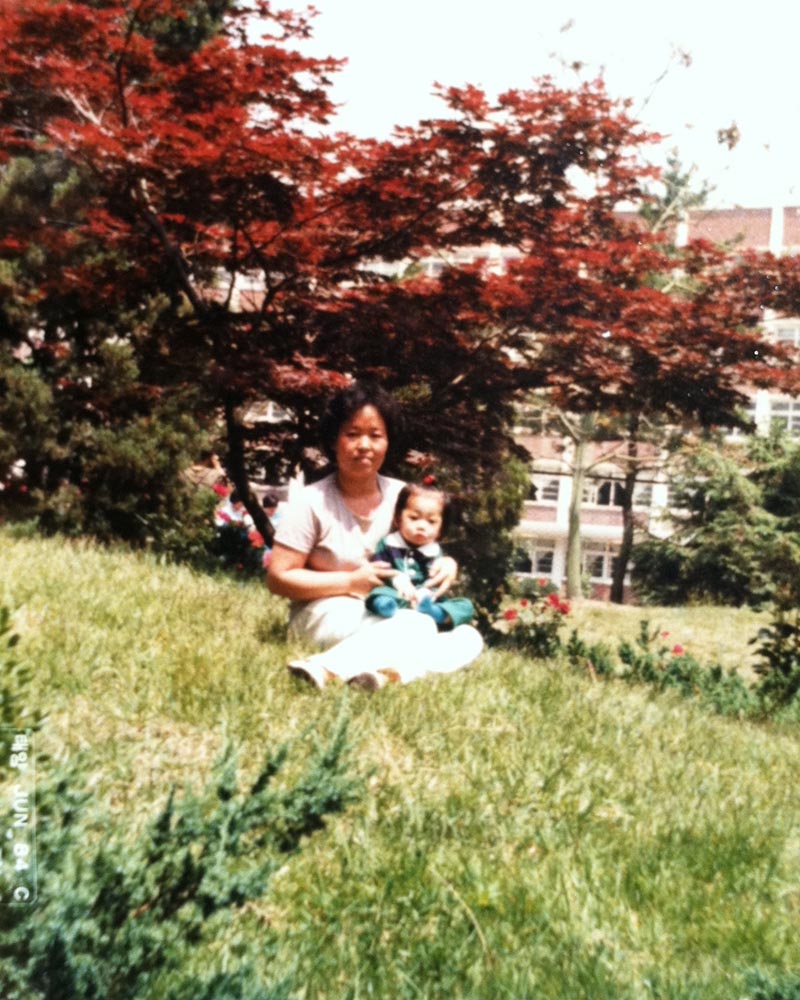 foster mother holding baby megan in a park