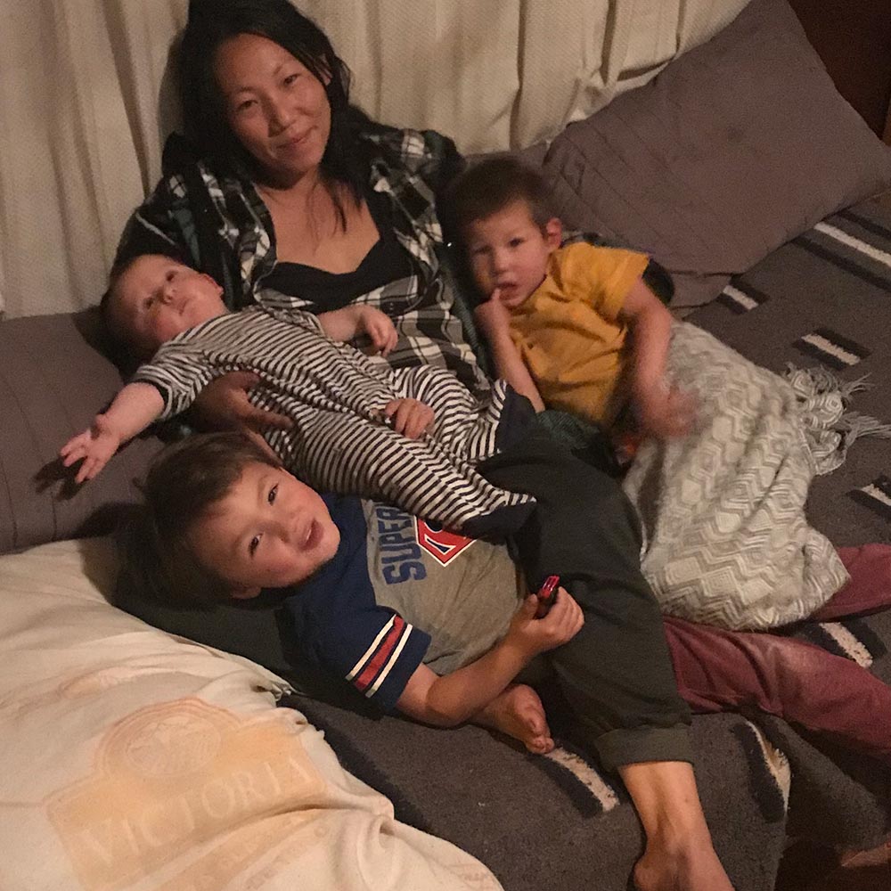 adoptee cuddling with her three children