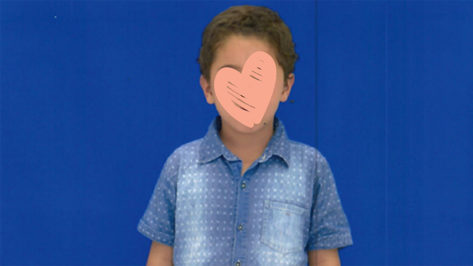 yvon needs an adoptive family standing in front of blue background with heart over face