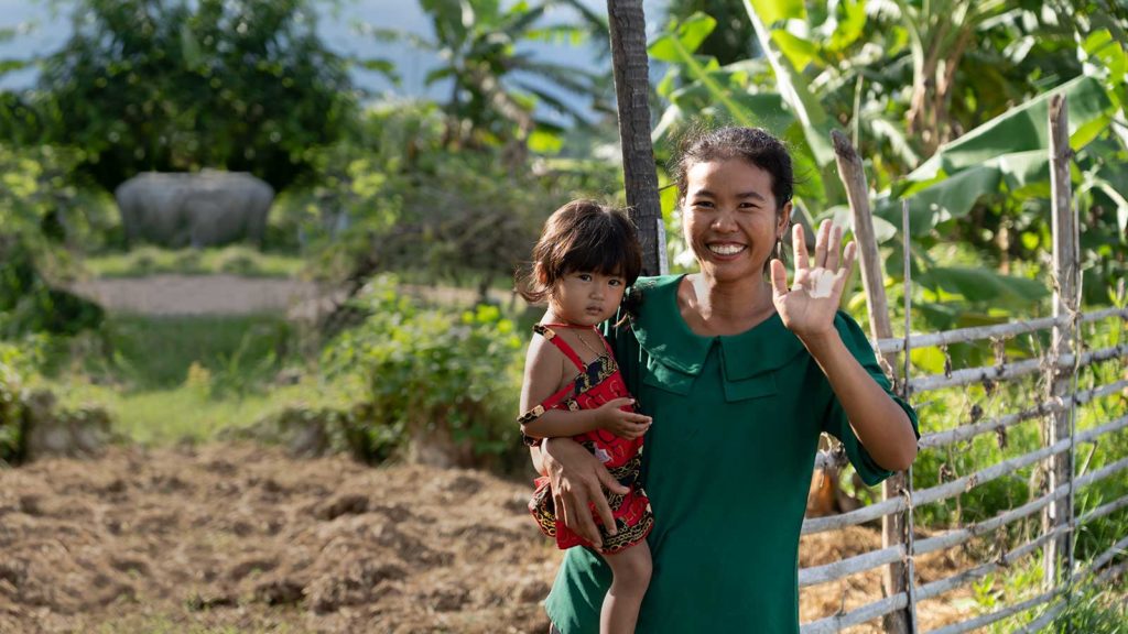 waving mom and young daughter thriving in holts programs