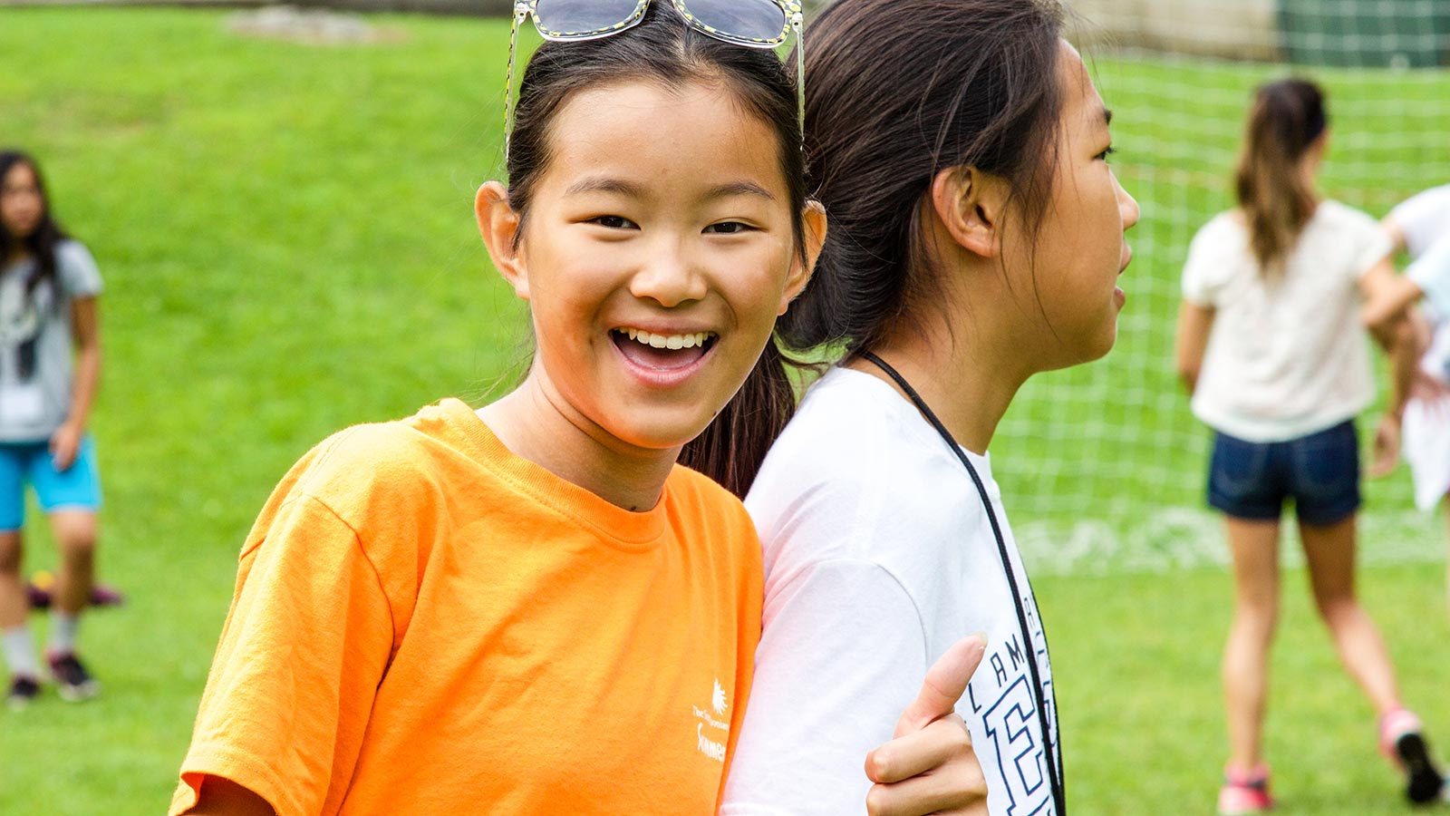 girl at holt adoptee camp giving thumbs up