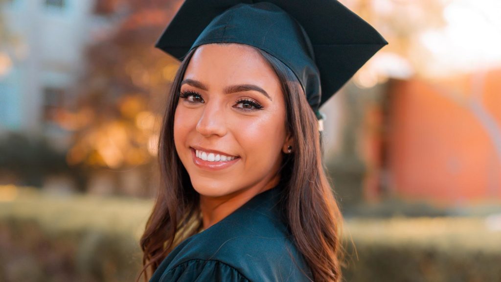 adoptee scholarship contest picture of girl wearing graduation cap and gown