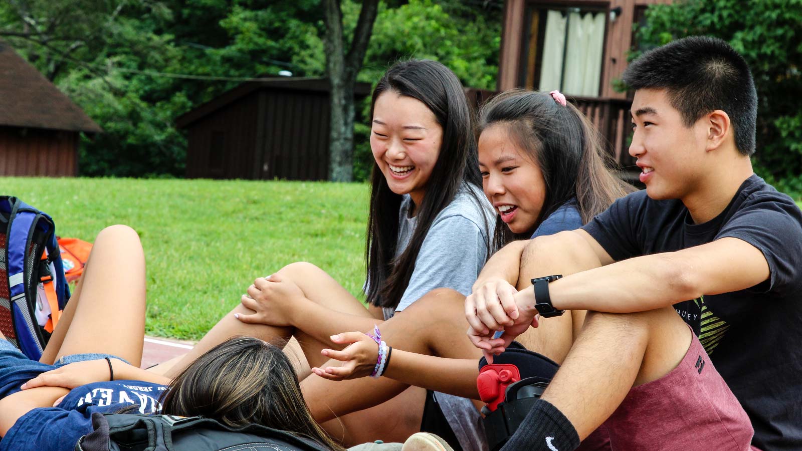 group of adoptees laughing together at adoptee camp